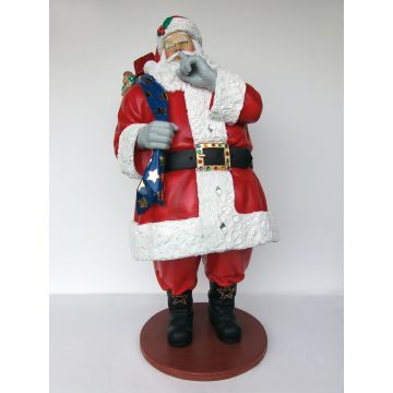 Großer Weihnachtsmann mit Sack voller Geschenken lebensgroß