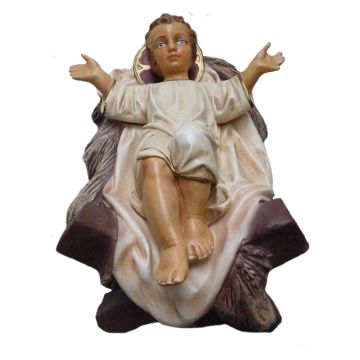 Jesuskind liegend in Krippe verkleinert