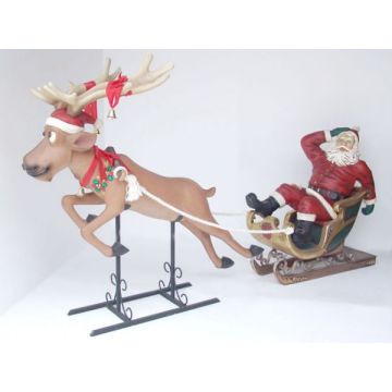 Lustiger Rentierschlitten mit Weihnachtsmann lebensgroß